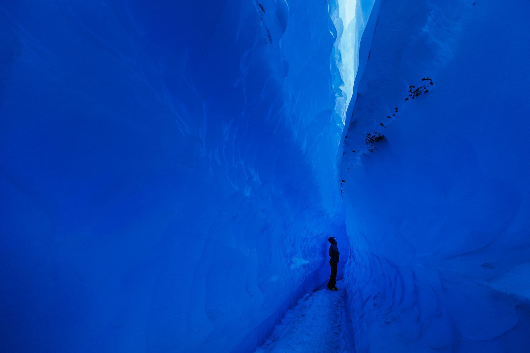 Walk through the mesmerizing sapphire blue walls of the Ice Tunnels