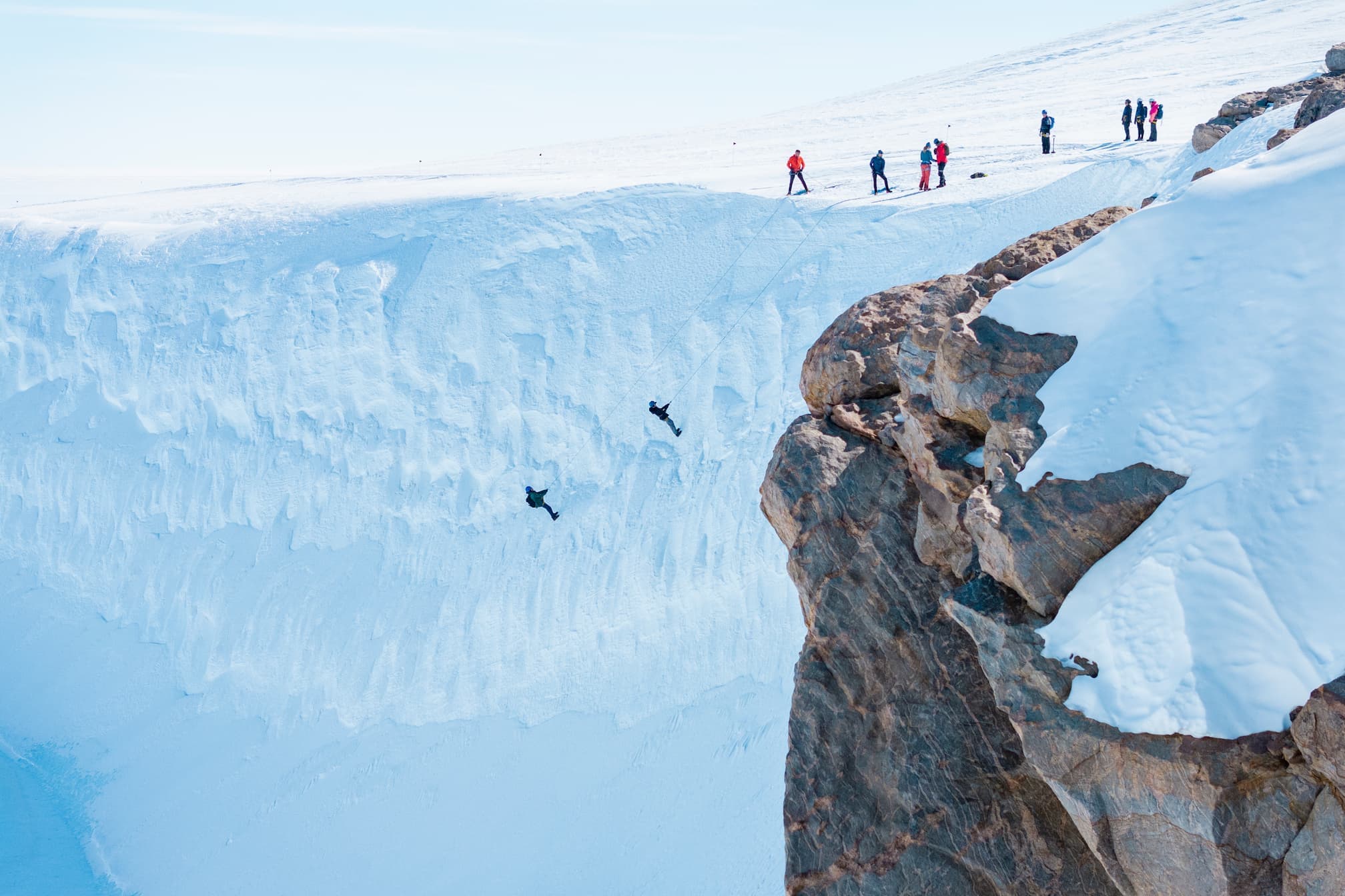 Abseiling down a glacier wall